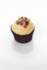 Cupcake with colored chocolate beans — Stock Photo