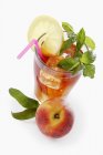 Iced tea with peach and mint — Stock Photo