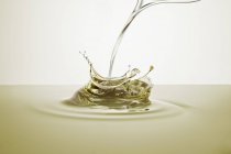 Download Closeup View Of A Splash Of Yellow Oil Drinkable Calories Stock Photo 156101468 Yellowimages Mockups
