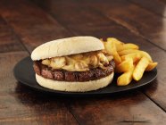 Beef burger with potato fries — Stock Photo
