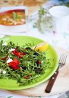 Rocket salad with olives — Stock Photo