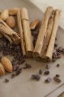 Cinnamon sticks, almonds and cacao nibs — Stock Photo