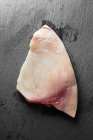 Swordfish steak on grey — Stock Photo