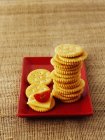 Cheese crackers with tomatoes — Stock Photo