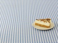 Slice of cheesecake with walnuts — Stock Photo