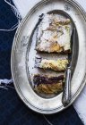 Closeup view of plum and chocolate strudel on a silver plate — Stock Photo