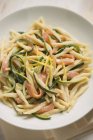 Trofie pasta with smoked salmon — Stock Photo