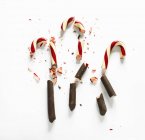Chocolate-dipped candy canes — Stock Photo
