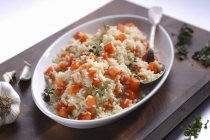 Rice with carrots and garlic — Stock Photo