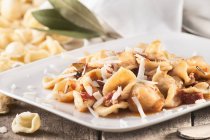 Orecchiette pasta with meat and sausage sauce — Stock Photo