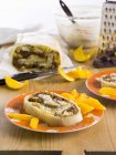 Closeup view of marzipan roulade with oranges — Stock Photo