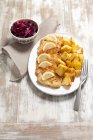 Closeup view of turkey escalope with baked potatoes and beetroot salad — Stock Photo