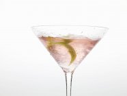 Cosmopolitan with lime zest — Stock Photo