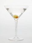 Martini with green olive — Stock Photo