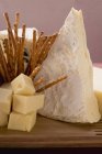 Cheese board with sticks — Stock Photo