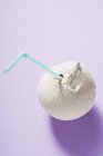 Shelled coconut with straw — Stock Photo