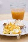 Scrambled egg on plate — Stock Photo
