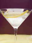 Martini with lemon zest — Stock Photo