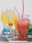 Exotic cocktails on tray — Stock Photo
