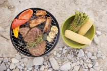 Meat and vegetables on barbecue — Stock Photo