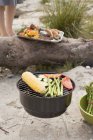 Elevated daytime view of vegetables on a barbecue — Stock Photo