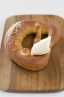 Pretzel with butter — Stock Photo