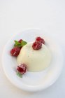 Panna cotta with raspberries on plate — Stock Photo