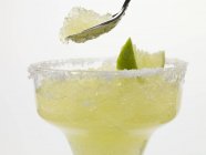 Frozen Margarita in glass and on spoon — Stock Photo