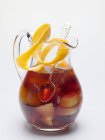 Sangria in a glass jug with orange peel — Stock Photo