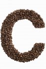 Lettre C écrite avec des grains de café — Photo de stock