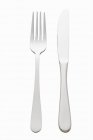Closeup top view of knife and fork on white background — Stock Photo