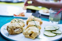 Closeup view of crepe parcels filled with chicken — Stock Photo