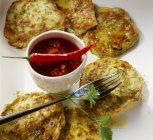 Courgette pancakes with salsa — Stock Photo