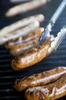 Grilling Sausages on barbecue — Stock Photo