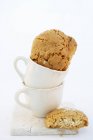 Almond biscuits in espresso cups — Stock Photo