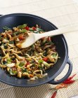 Closeup view of chicken with cashew nuts in wok — Stock Photo