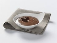 Chocolate blancmange in bowl — Stock Photo