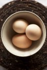 Chicken eggs in bowl — Stock Photo
