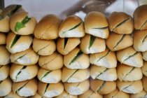 Split rolls filled with lettuce — Stock Photo