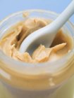 Peanut butter in jar — Stock Photo