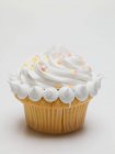 Cupcake with cream and sugar — Stock Photo