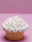 Cupcake with cream and sugar — Stock Photo