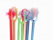 Closeup view of plastic cocktail sticks on white background — Stock Photo
