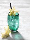 Alcohol Cocktail with star fruit — Stock Photo