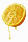 Orange dripping juice — Stock Photo