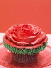 Cupcake with red marzipan — Stock Photo