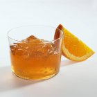 Orange jelly in glass and orange wedge — Stock Photo