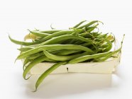 Fresh Green beans in wooden container — Stock Photo