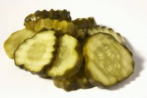Pile of Pickle Slices on white background — Stock Photo
