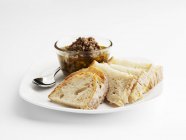 Tapenade and slices of bread — Stock Photo
